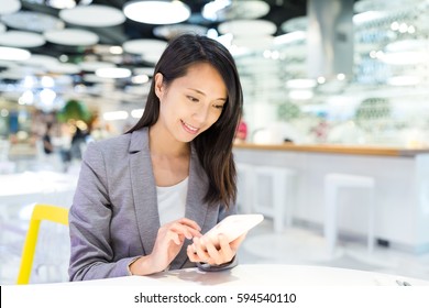 Businesswoman Use Of Cellphone In Co Working Space