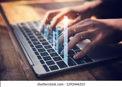 Businesswoman use laptop ,analytics and financial and bank technology concept, chart from computer laptop,Business growth concept - Shutterstock ID 1292446315