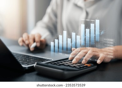 Businesswoman use laptop and tablet analyzing company growth, future business growth arrow graph, development to achieve goals, business outlook, financial data for long term investment.