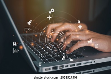 Businesswoman using a computer to AR virtual screen dashboard with project management with icons of scheduling, budgeting, communication. - Shutterstock ID 2051529509