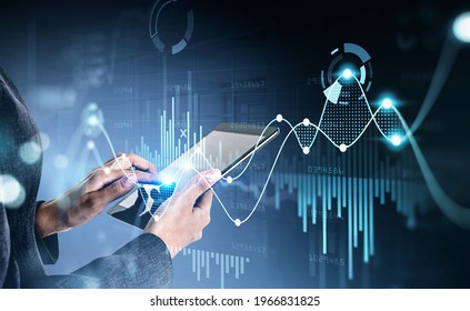 Businesswoman using digital tablet device, stock market changes, business graph bar chart. Double exposure of blue white white lines, growing numbers. Concept of online trading and technology