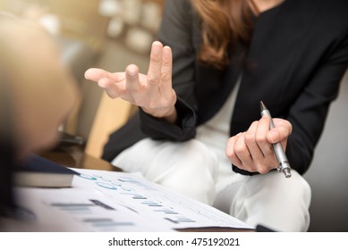 Businesswoman Using Hand Gesture While Sitting And Talking In The Meeting