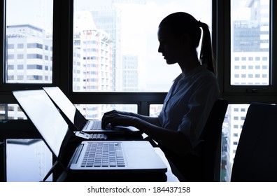 Businesswoman using laptop.
