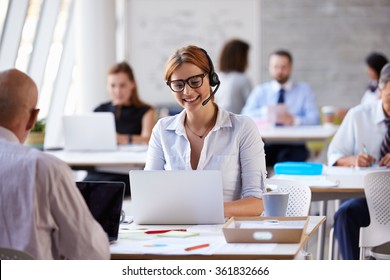 Businesswoman Using Laptop In Customer Service Department - Shutterstock ID 361832666