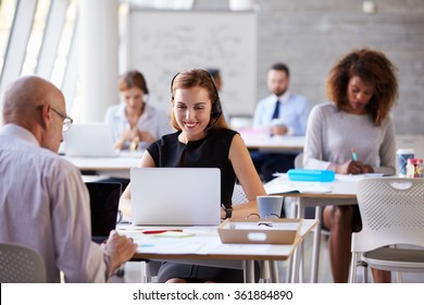 Businesswoman Using Laptop In Customer Service Department - Shutterstock ID 361884890