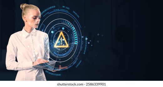 Businesswoman using a laptop with a glowing digital warning symbol and futuristic UI on a dark background. Concept of cybersecurity and data protection