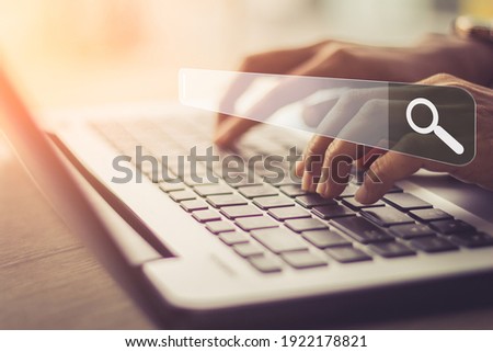 Businesswoman using laptop searching Browsing Internet Data Information.Networking Concept 