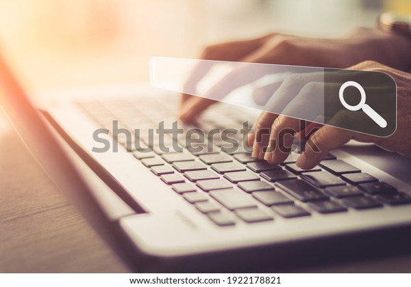 Businesswoman using\
laptop searching Browsing Internet Data Information.Networking\
Concept 