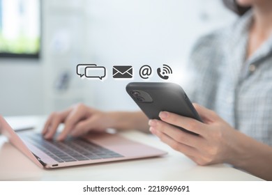 Businesswoman using mobile phone with contact communication icons online internet network service. email, website, message, phone. contact us concept. - Powered by Shutterstock