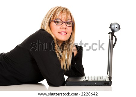 A businesswoman using notebook and webcam