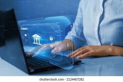Businesswoman using online banking on virtual screen. Digital innovation technology. Finance and banking networking.Online payments,cyber security and devices concept. 