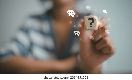 Businesswoman using question marks with speech bubbles.Q and A. Online service gives quick answers. FAQ concept