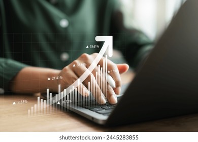 Businesswoman using tablet and laptop analyzing business growth graph data and progress, compass of navigate guiding market direction. Investment, banking and finance, strategy, Global economy.
 - Powered by Shutterstock