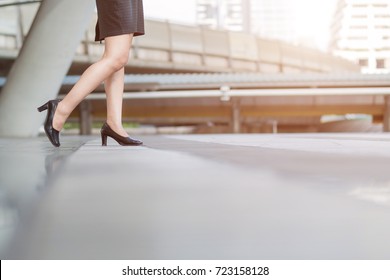 Businesswoman Walking Away Low Angle Cross Section In City.