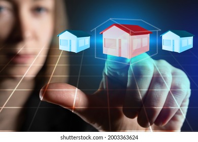 Businesswoman Wants To Lease A House. Concept - Real Estate Leasing. Buying Real Estate On Lease. Woman Chooses One Of Houses On Virtual Screen. Real Estate Investment. Buying A Home For Investment