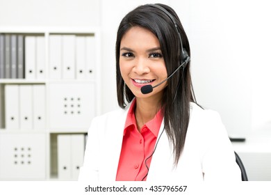 Businesswoman wearing microphone headset - operator, call center, telemarketing and customer service staff concepts