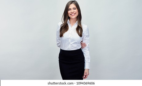 Businesswoman wearing white shirt standing in front of studio background. Isolated portrait.