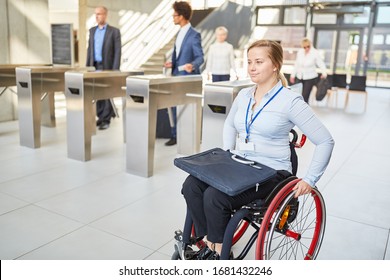 Businesswoman In A Wheelchair Accessible Past The Security Gate In The Office