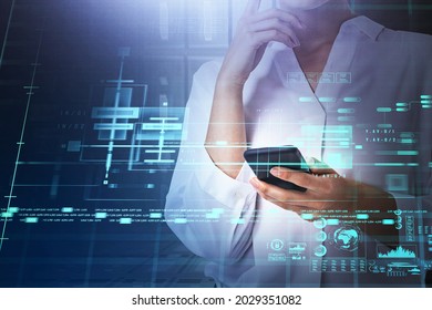 Businesswoman in white shirt is typing on smartphone with hologram of digital interface with globe, bar and pie diagrams. Concept of cloud data storage and information security and communication