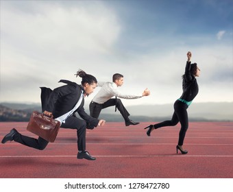Businesswoman wins a run contest against the competitors. Concept of success