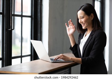 Businesswoman Working With Laptop Computer And Online Talking To Someone In Office