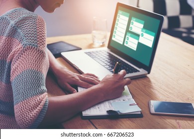 Businesswoman working with laptop, Writing something idea on notebook or check list in office - Shutterstock ID 667206523
