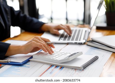 Businesswoman working at office with documents on his desk, doing planning analyzing the financial report, business plan investment, finance analysis concept