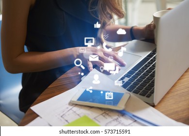 Businesswoman working an office with mobile app icons - Powered by Shutterstock