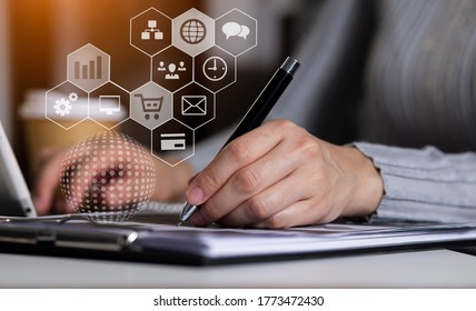 Businesswoman working on digital tablet 
computer with financial chart from the screen and network interface icons, Business analytics and financial technology concept. - Powered by Shutterstock