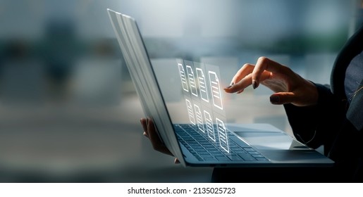 Businesswoman working on a laptop computer to document management online documentation database digital file storage system software records keeping database technology file access doc sharing.