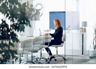 Businesswoman Working on Projects in Modern Glass Office Environment. - Powered by Shutterstock