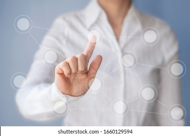 Businesswoman working with touchscreen, dots and lines on the screen. - Powered by Shutterstock