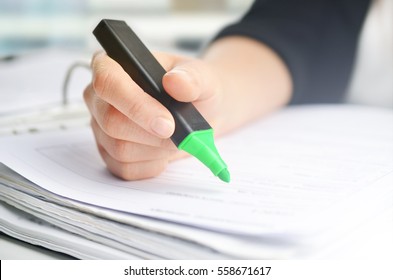 Businesswoman writing documents