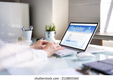 Businesswoman's Hand Filling Online Registration Form On Laptop - Shutterstock ID 2118855365
