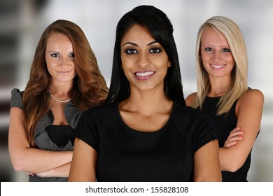 Businesswomen Of All Races Working Together In An Office