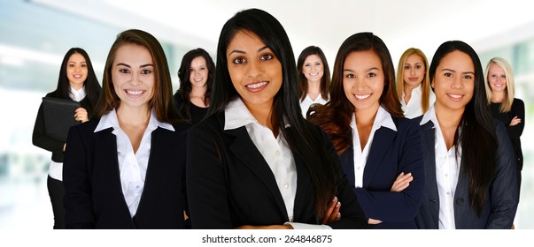 Businesswomen Of All Races Working Together In An Office