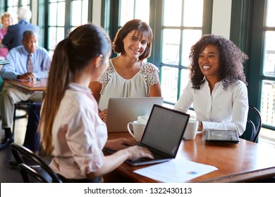 Businesswomen Having Informal Meeting Around Table In Coffee Shop - Shutterstock ID 1322430113
