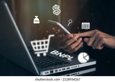 Businesswomen holding a smartphone with icons of BNPL with online shopping icons technology. BNPL Buy now pay later online shopping concept. - Shutterstock ID 2128934267