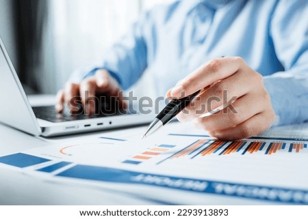 Businesswomen or investor working with financial statements and analyze company financial reports. investment, balance sheets, taxes, planning and business strategies concept.
