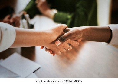 Businesswomen shaking hands making a business deal - Powered by Shutterstock