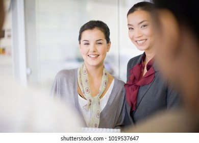 Businesswomen Talking In Office