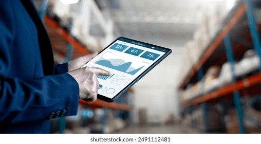 Businesswomen use tablet working for analysis of business report dashboards for the stock inventory, a Smart warehouse management system, supply chain and logistic network technology concept.
 - Powered by Shutterstock