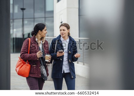 Similar – Image, Stock Photo Two teenagers race through the sunshine on a sled, dusted with snow