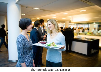 Businesswomen In Work Cafeteria Talking