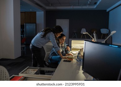Businesswomen working late in office - Shutterstock ID 2123995931
