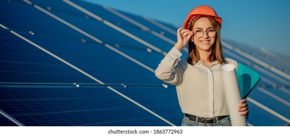 Businesswomen working on checking equipment at solar power plant with tablet checklist, woman working on outdoor at solar power plant.