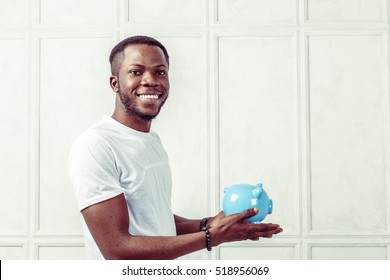 Businness Black Man With Piggy Bank