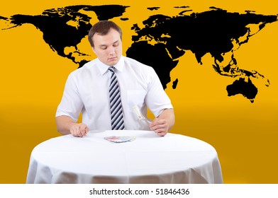 Bussines Man Eat Euro On Lunch, Map Of World As Background