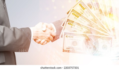 Bussines Man Shakes Hand Of A Partner With A Money