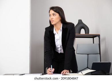 Bussines Woman In Black Suit Working At Office